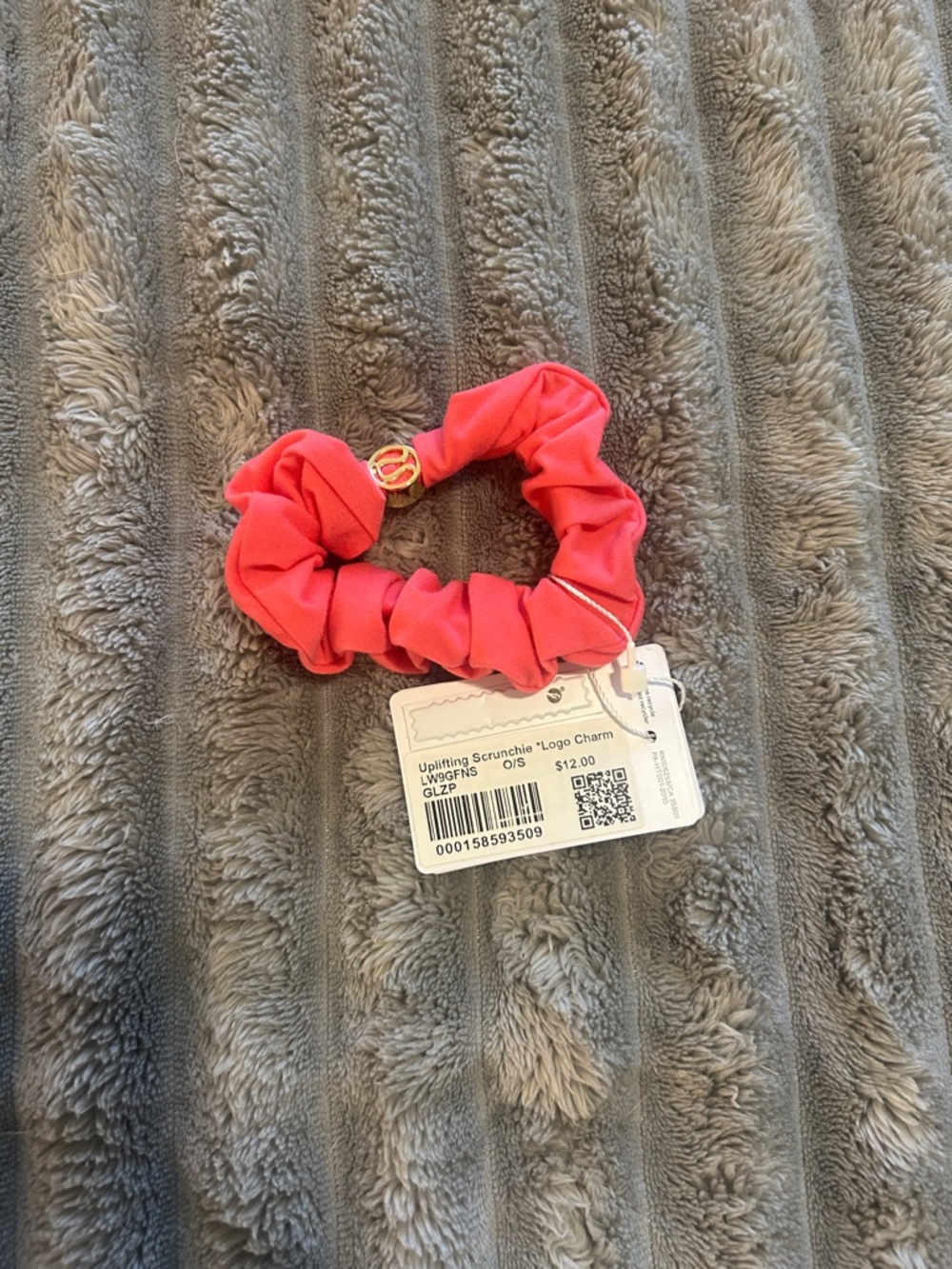 Lululemon Uplifting Scrunchie in Coral Pink with Logo Charm - Gold Hardware